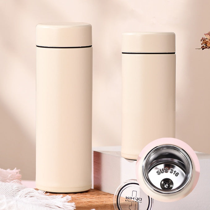 Portable mini ceramic-lined insulated travel cup in titanium stainless steel, available in 150ml to 300ml sizes, ideal for hot and cold drinks on the go
